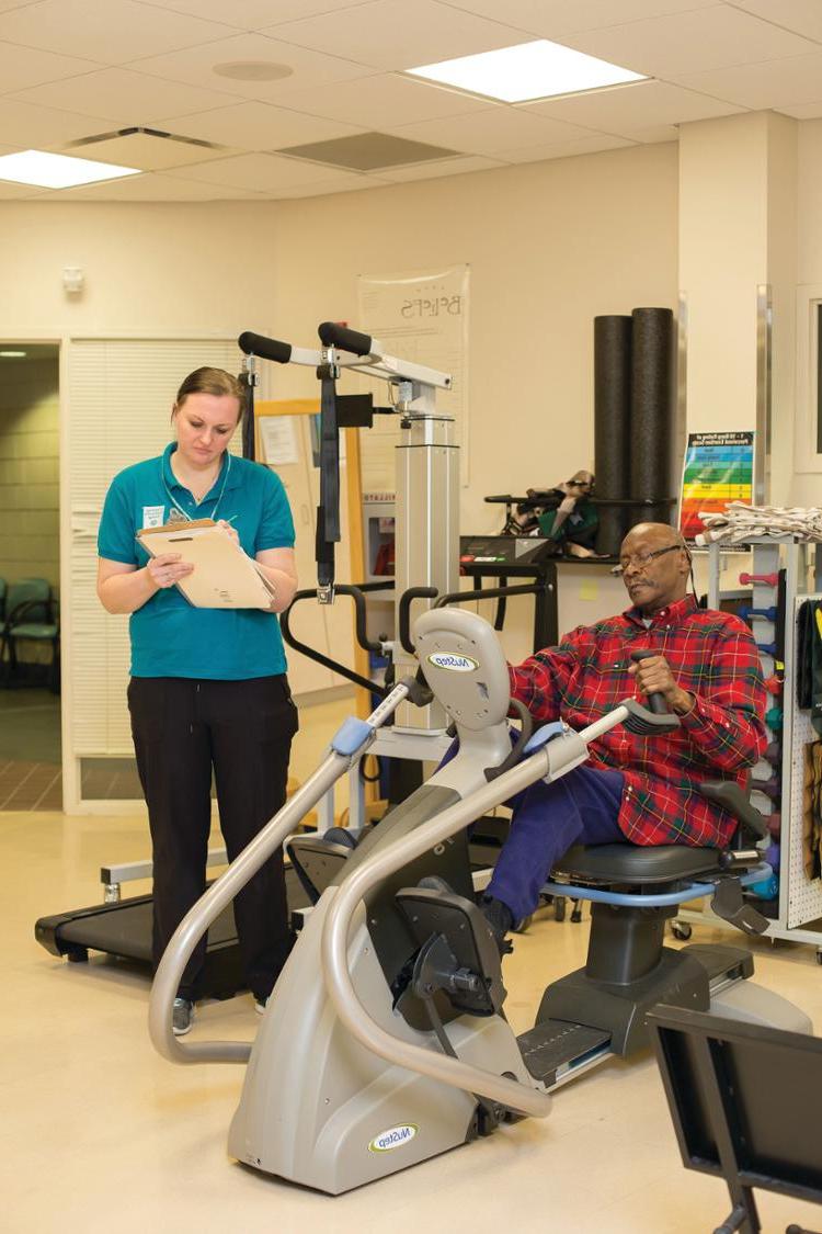 OT cutting bread with patient